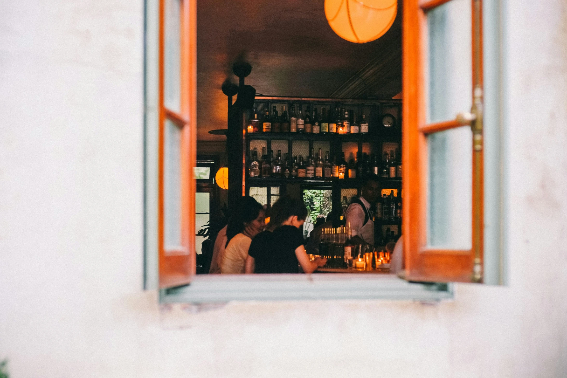 a view of an orange window and the bar in the back