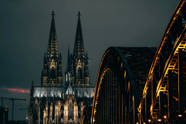 a large cathedral lit up at night in the city