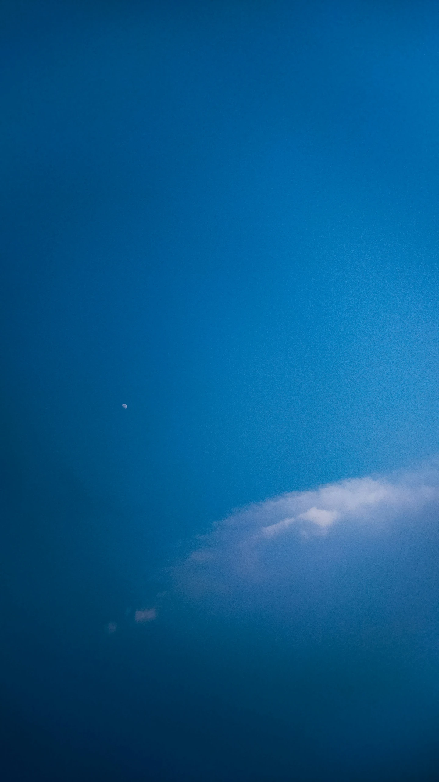 a large plane flying in the sky during the day