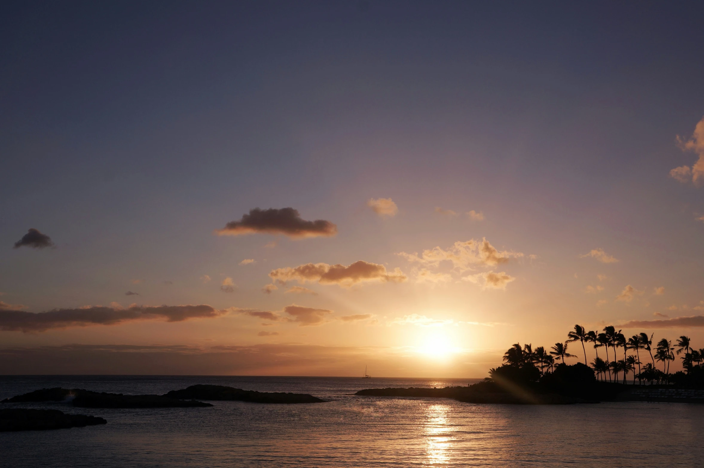 sun is reflected off of the water at sunrise