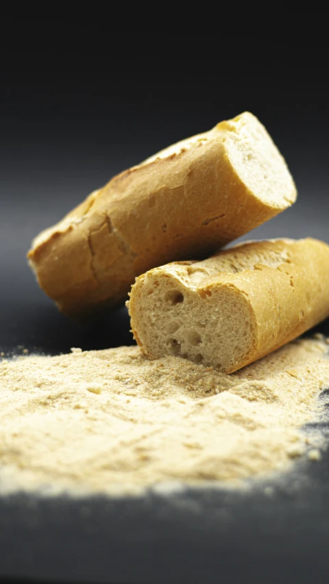 two pieces of bread sitting on top of a table