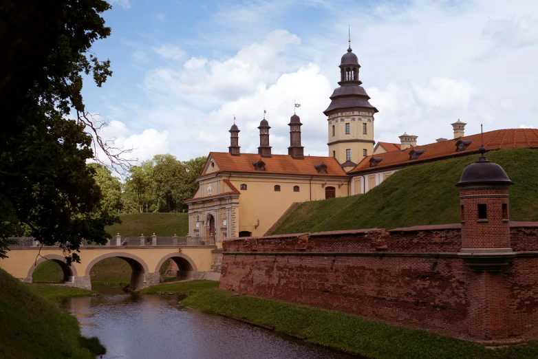 a scenic view of a town with water running through it