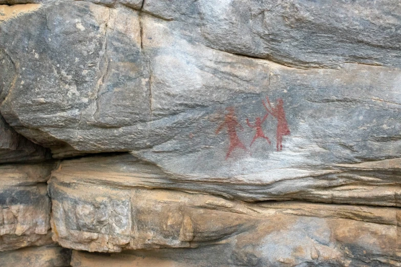 red rocks are painted on them with small red writing