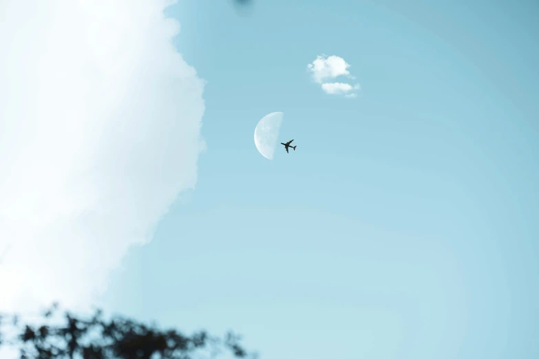 a person is flying in the air with a parachute