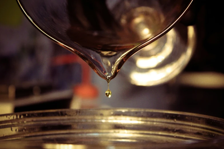 liquid poured into silver metal tray with clear glass