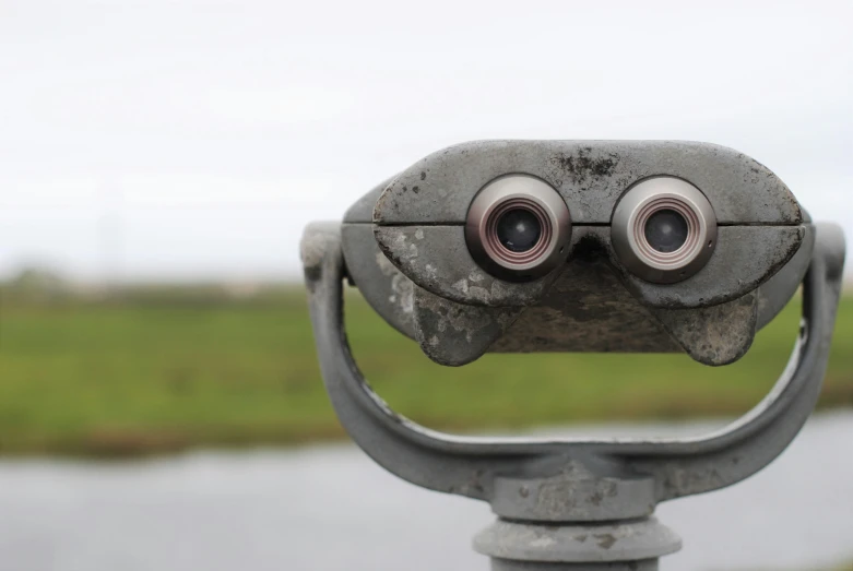 a close up of a pair of binoculars with the eyes opened