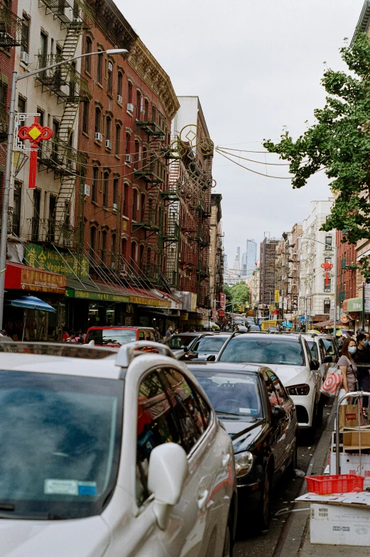 busy city street with people standing on steps