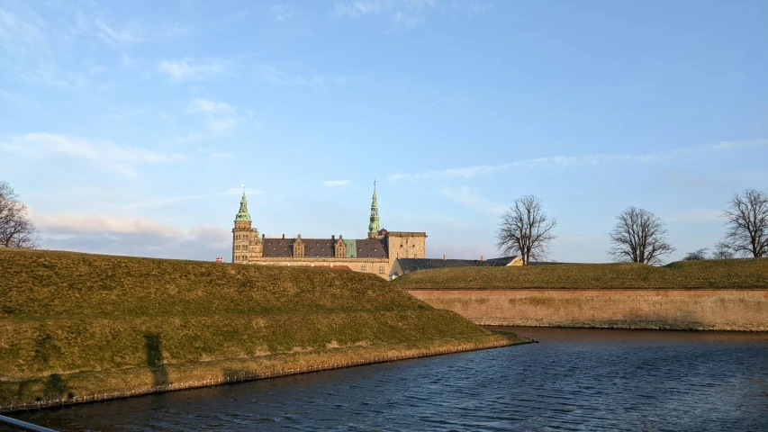 a long s of a castle by the water