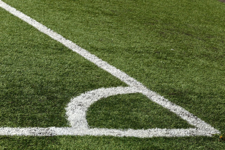 the line of a baseball field with a red ball