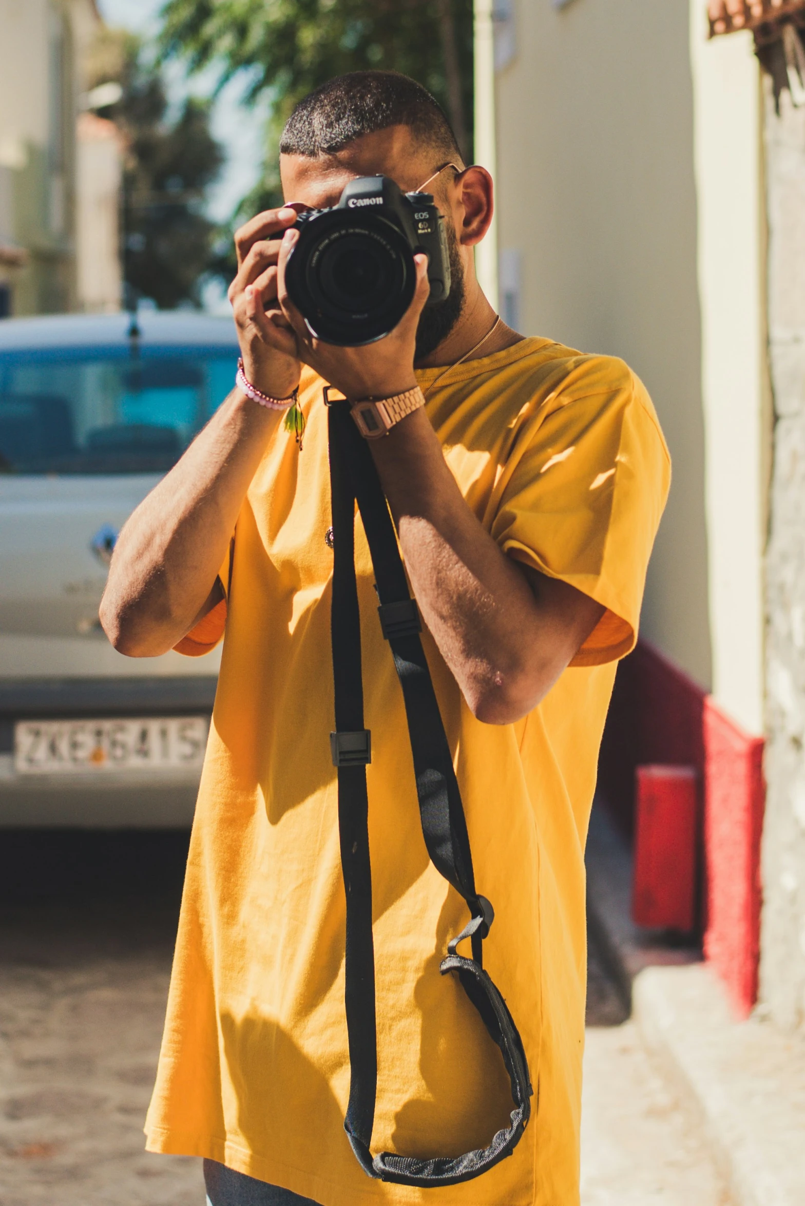 a man standing in front of a building taking a po