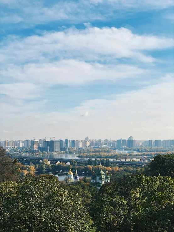 the view of a city from the top of a hill