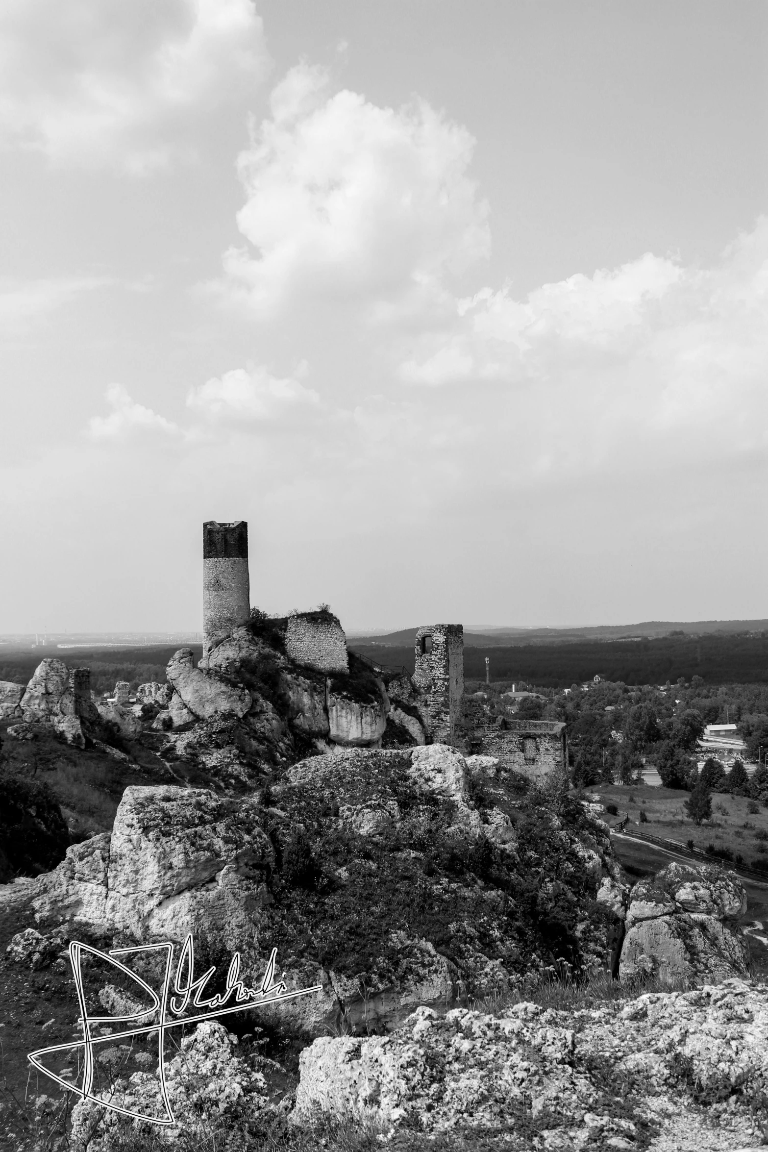 a black and white po shows a mountain with many rocky cliffs