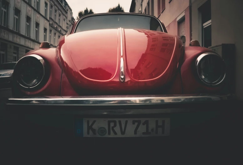 a red car in the city waiting for passengers