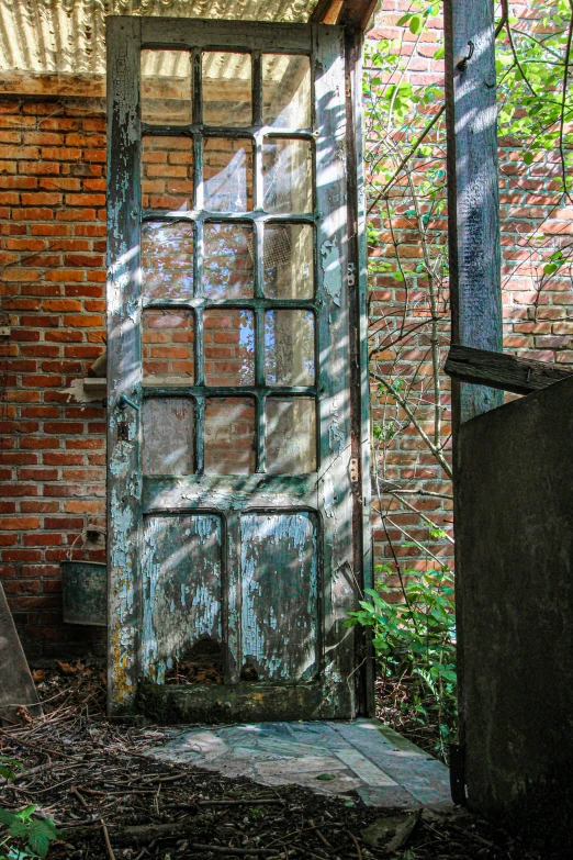 an open door is shown in a brick building