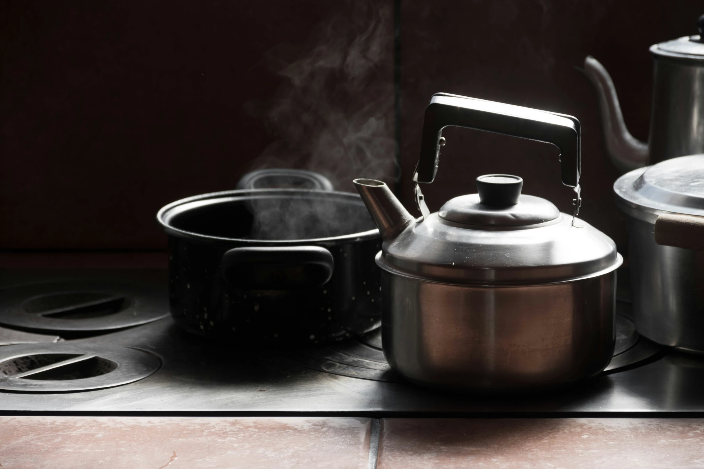 pots and pans sit on a stove and burners