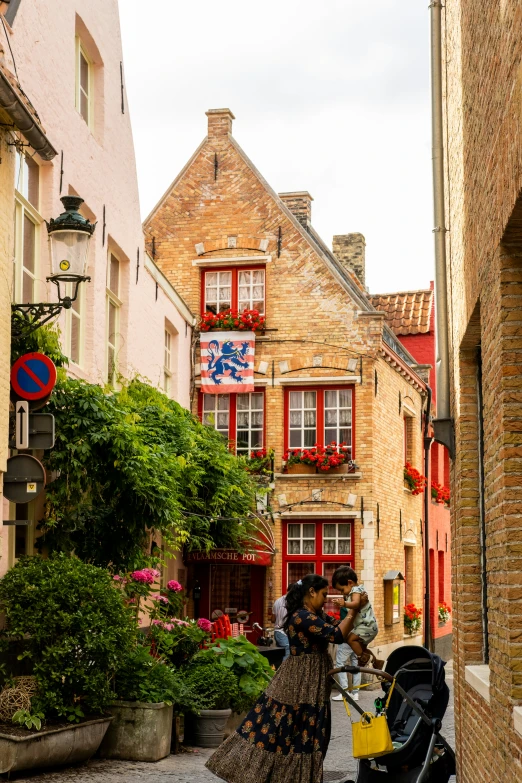 a group of people are standing in a narrow alleyway