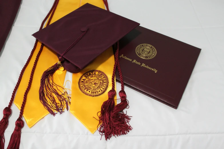 this is a graduation cap, diploma and other items