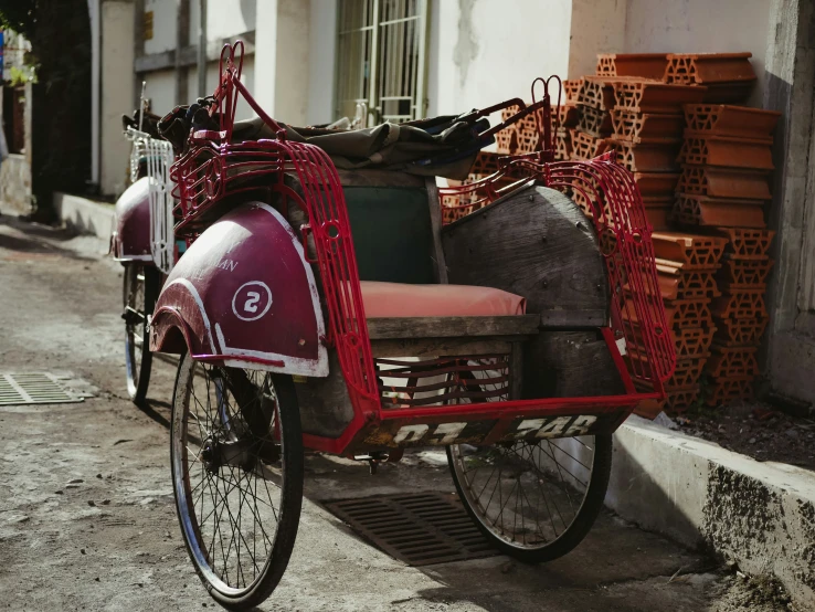 this is an old fashioned tricycle parked on the street