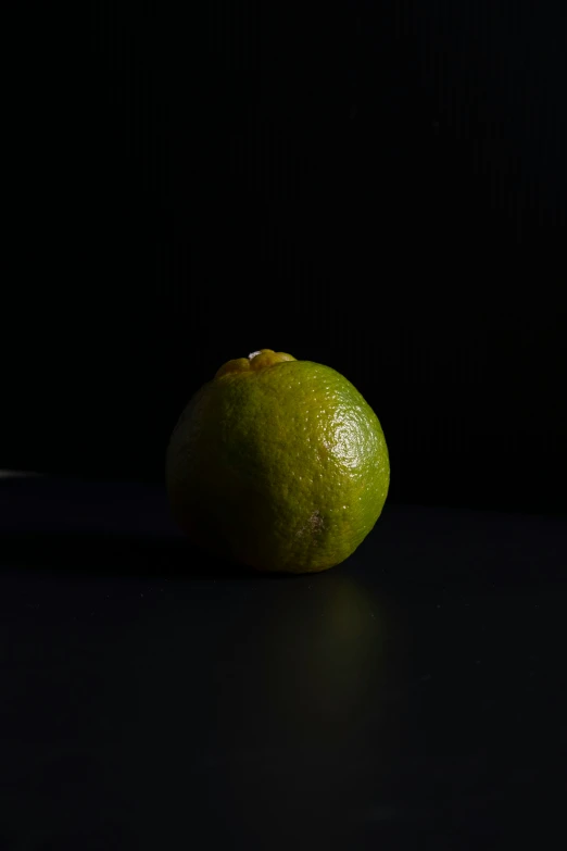 the lime is sitting on the black counter