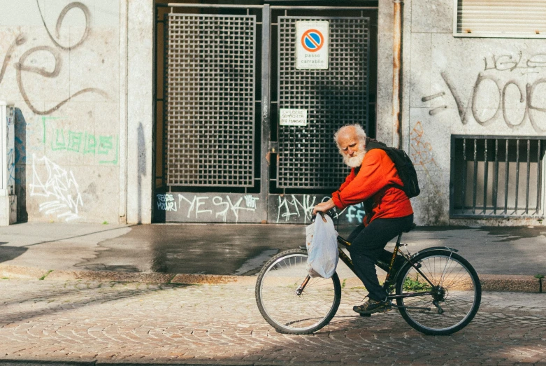 a man riding a bicycle on a city street