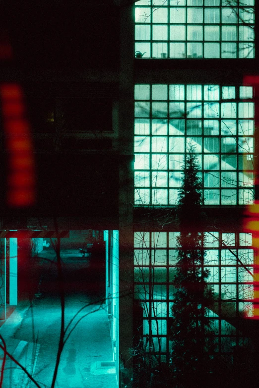 an image of a city at night seen through the windows of a building