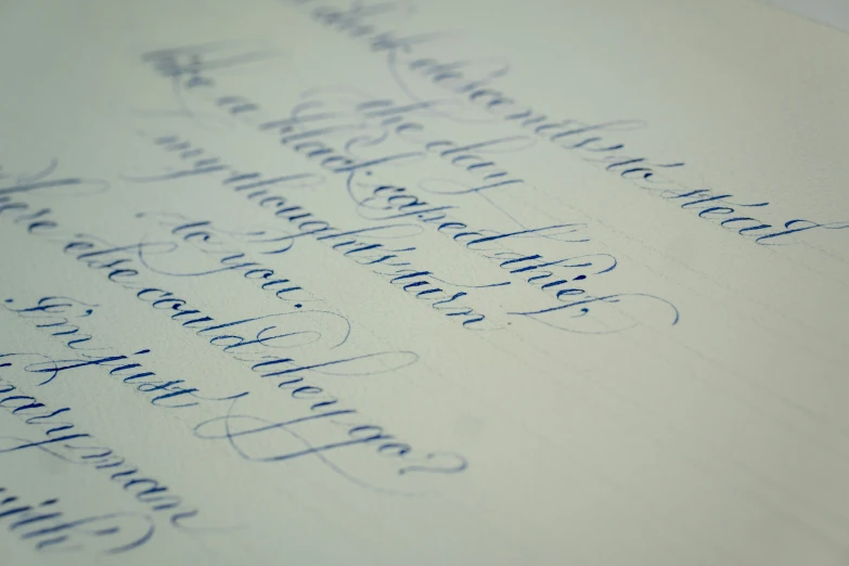 handwriting written on top of white paper with writing and writing