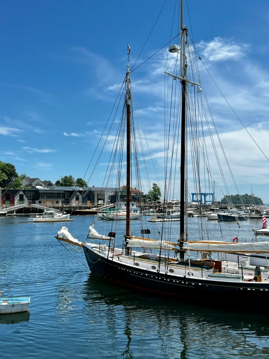 a boat sailing on the water near a marina