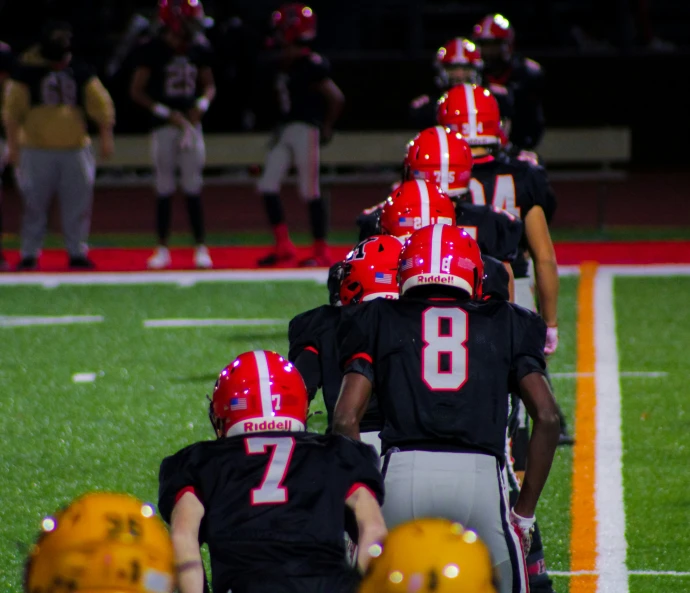 a group of football players on the field playing a game