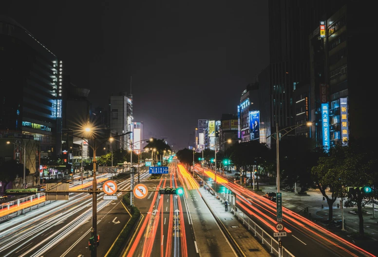 city street at night with long exposure of city lights