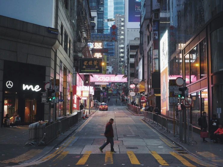 a woman walking down the street in the city