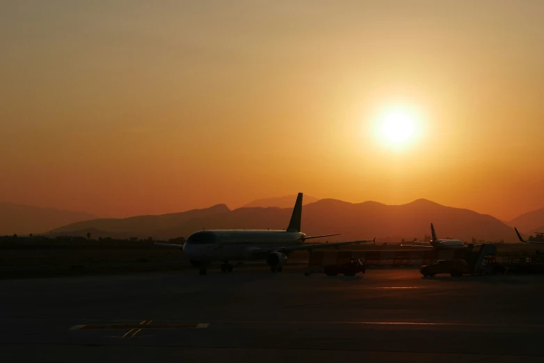 an airplane and some people are preparing to board