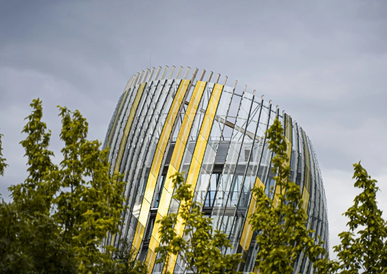 a building in a city with various metal panels