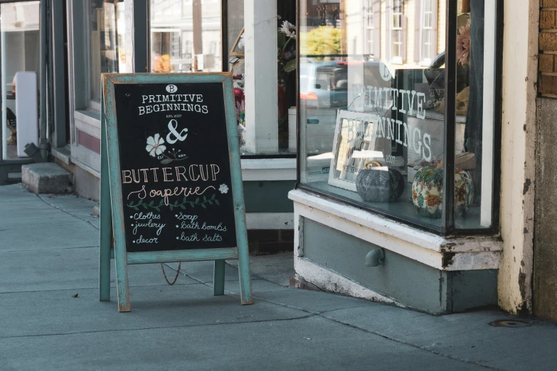 the sidewalk has a menu board in it