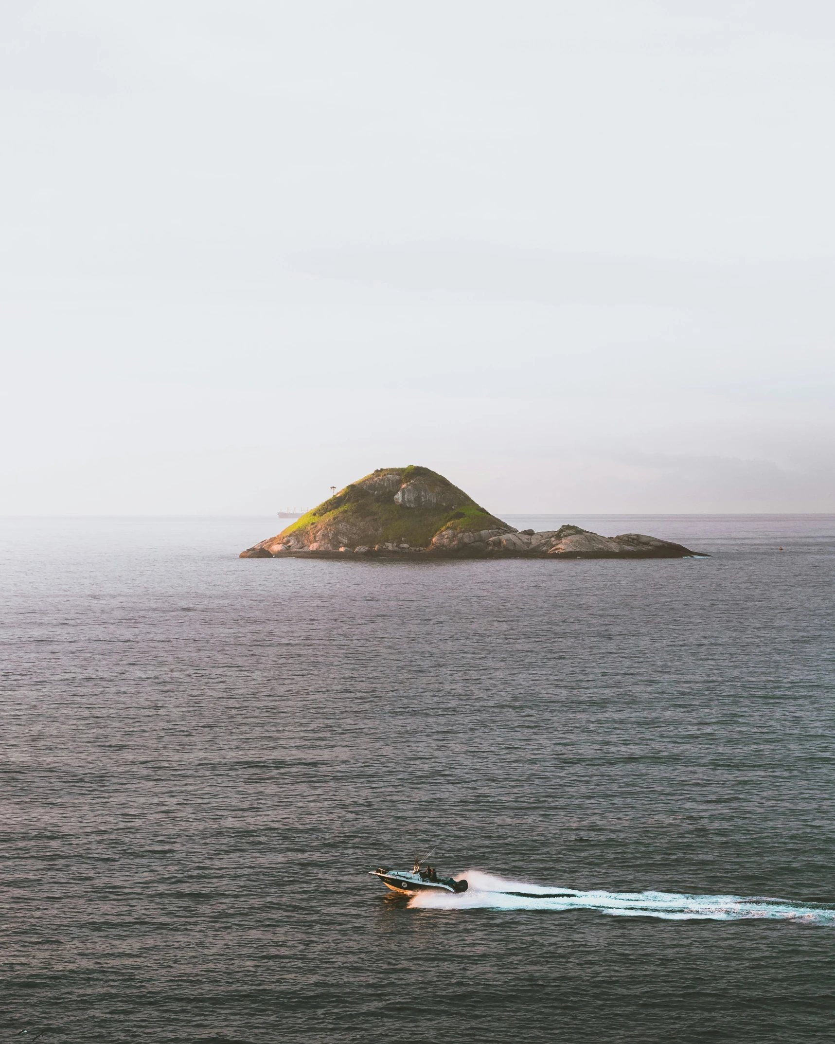 the person is water skiing near a island