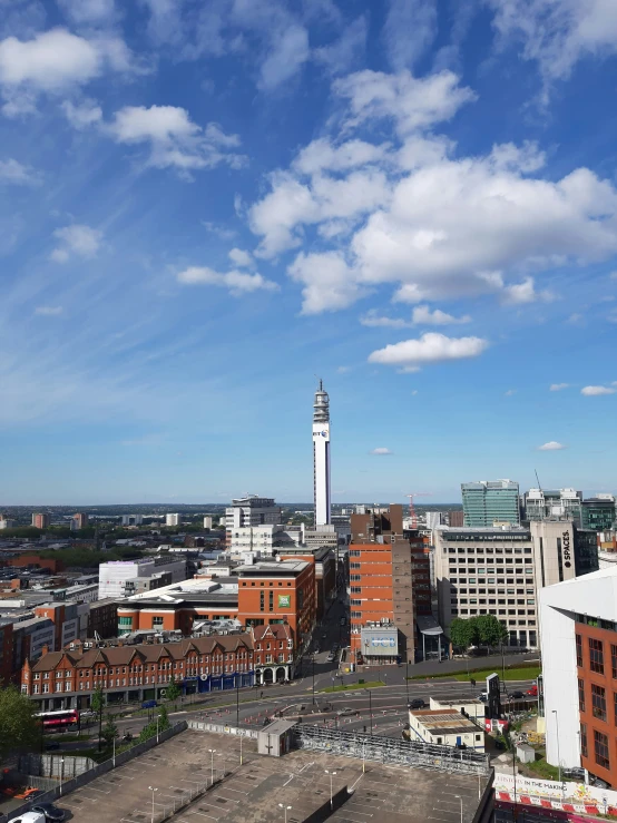 a view of buildings with some clouds above