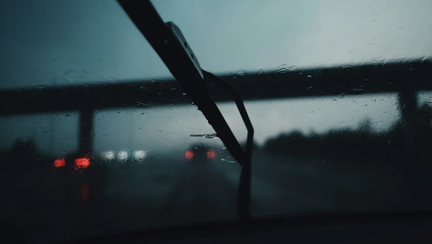 a windshield with a street lights through it