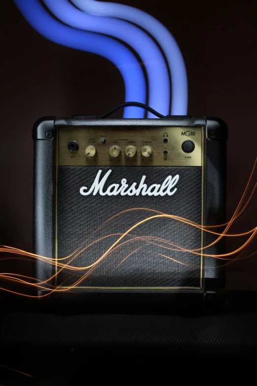 blue and yellow light in front of a black guitar amplifier