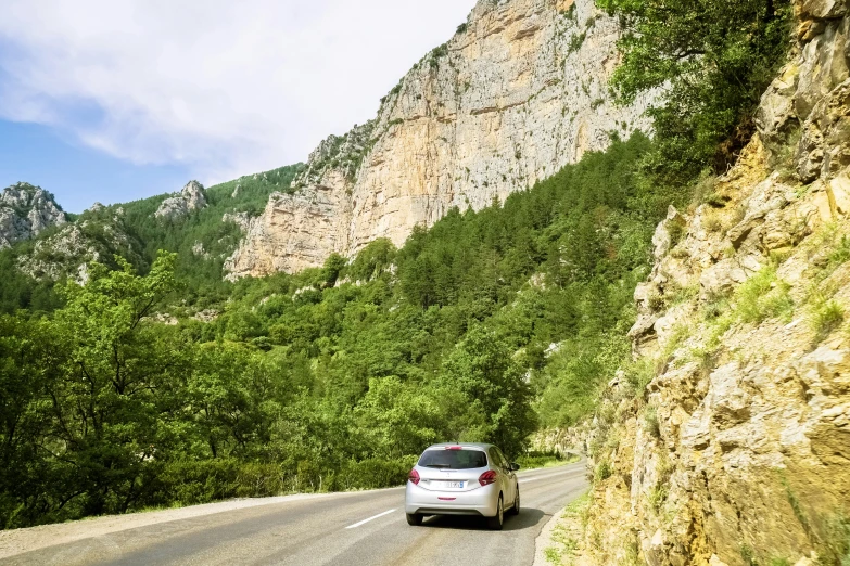 a car that is driving down a mountain road