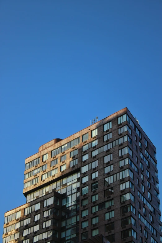 looking up at a very tall, modern building