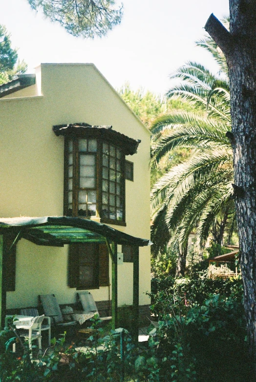 the patio and a front porch are shown in the daytime sun