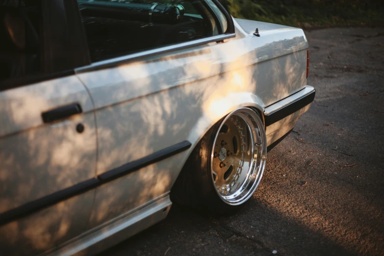 close up of front wheels on white bmw e36