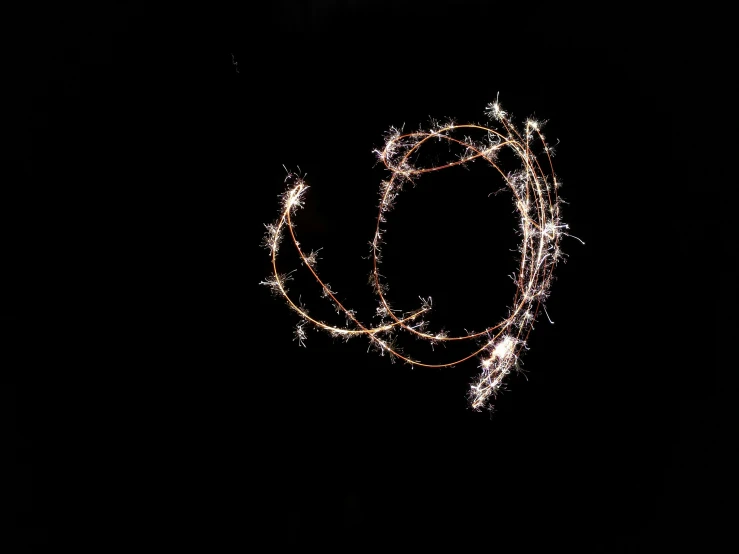 an artistic pograph of christmas lights against a black background