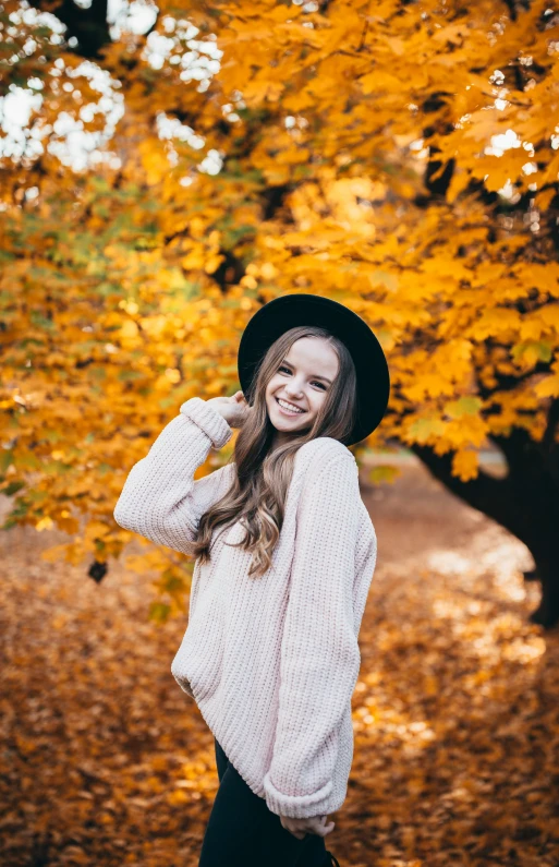 an image of woman standing in the fall