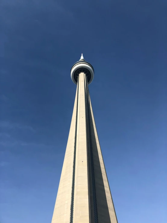 the tall tower is sitting high in the sky