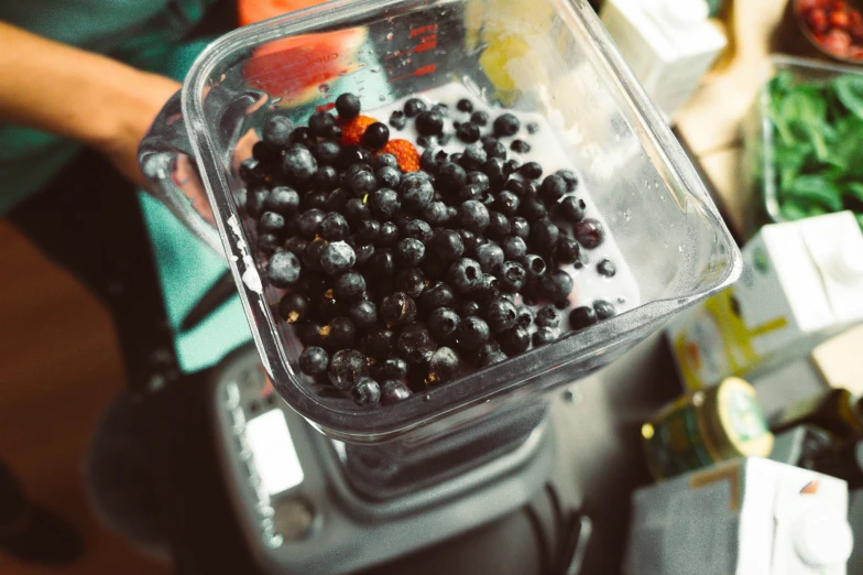 berries are placed in the container on the scale