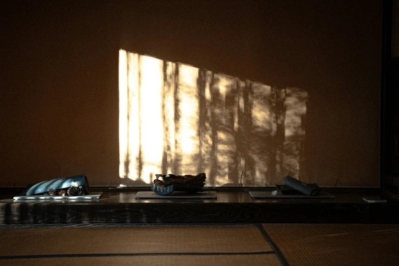 a white vase sitting on top of a wooden table