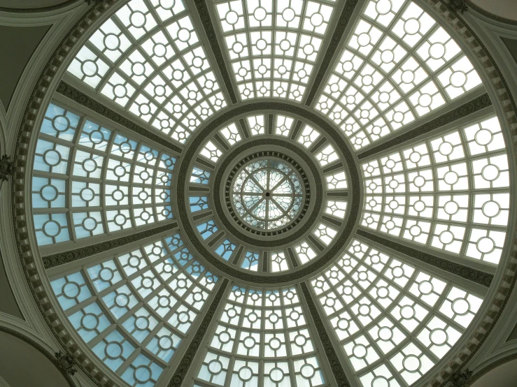 a circular glass window in the center of a room