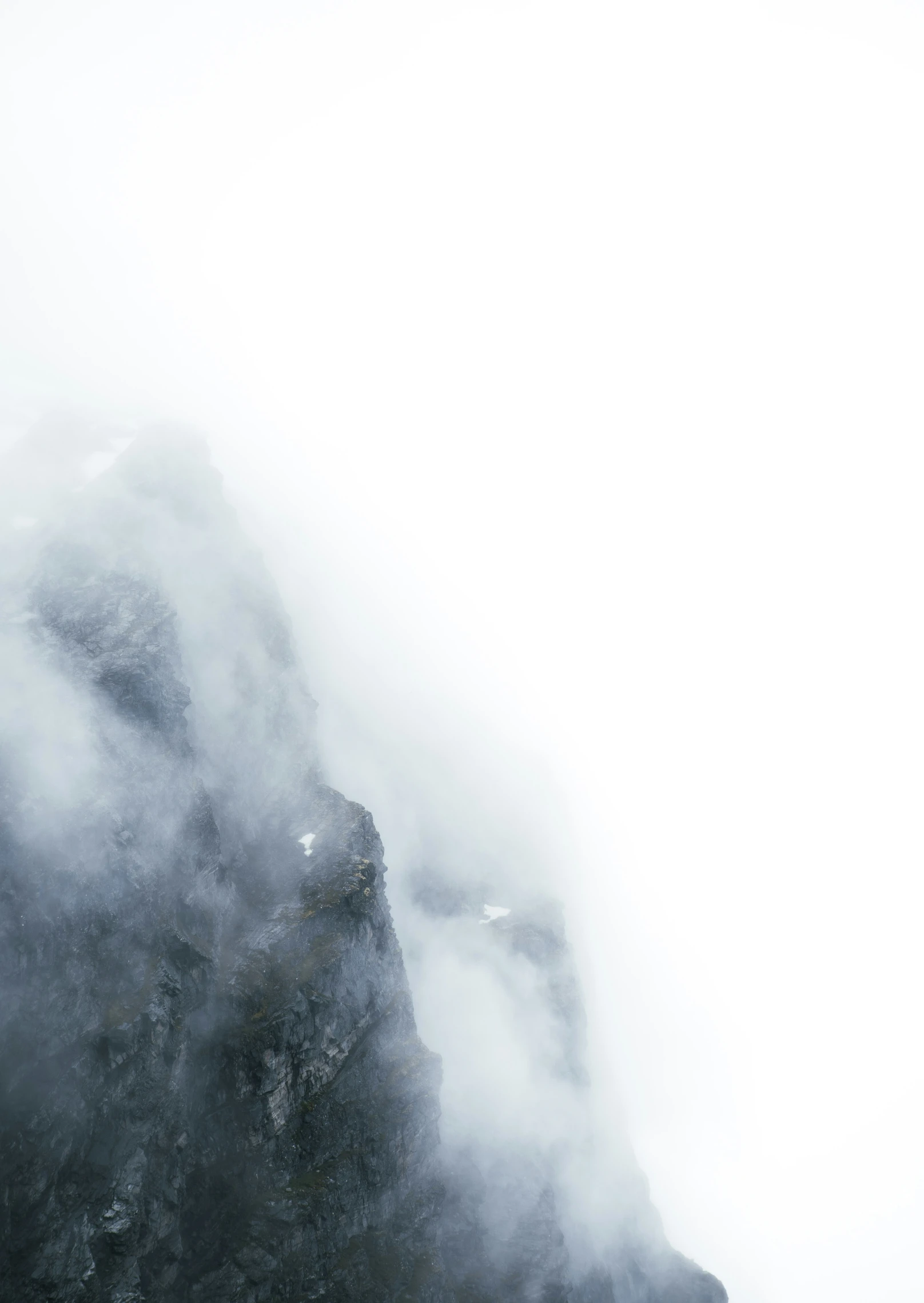 the mountain covered in fog with very low clouds