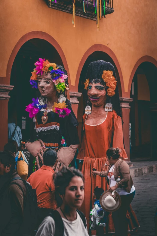 two young ladies are all dressed up in traditional costumes