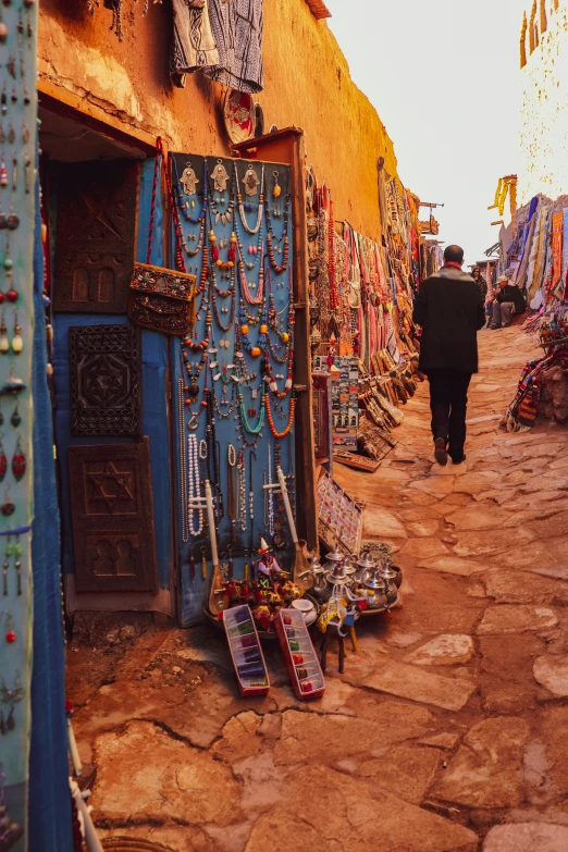 many colorful objects are on display on the side of this building